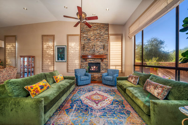 Luxury living area with 2 green sofas in a house for sale in Tucson